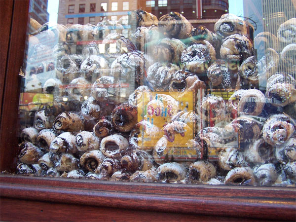 Pastries called "Cigars" in the window of Roxy's Deli.